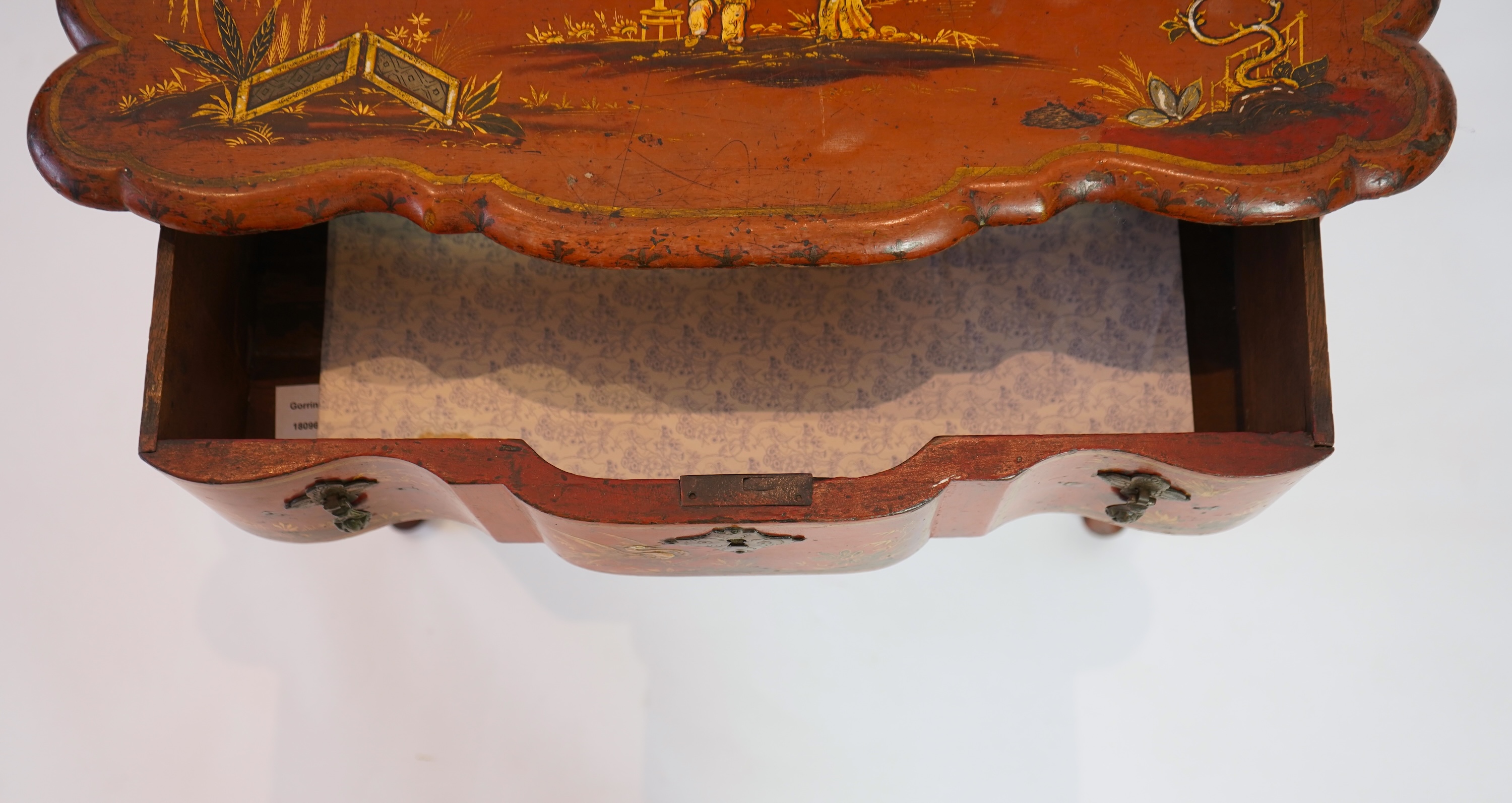 An early 18th century scarlet japanned lowboy